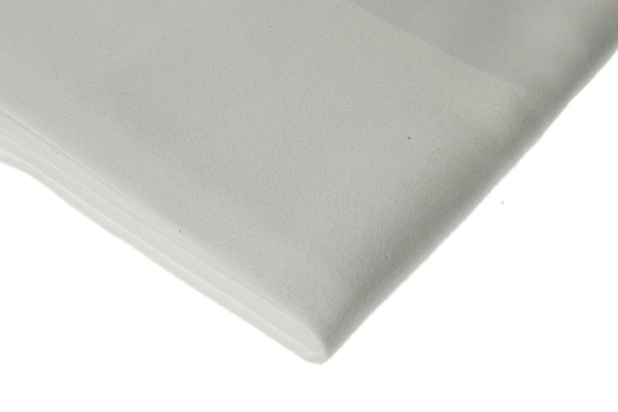 Eight shirts arranged on table in black, olive, grey, blue, white, red, mustard, and green.